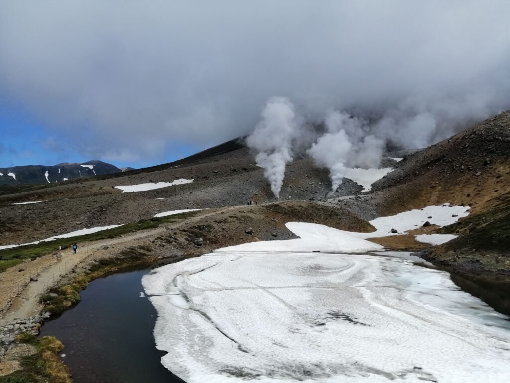 Steam rising from the bottom of Asahidake.