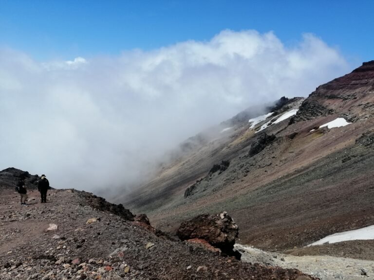 A valley with rolling clouds.